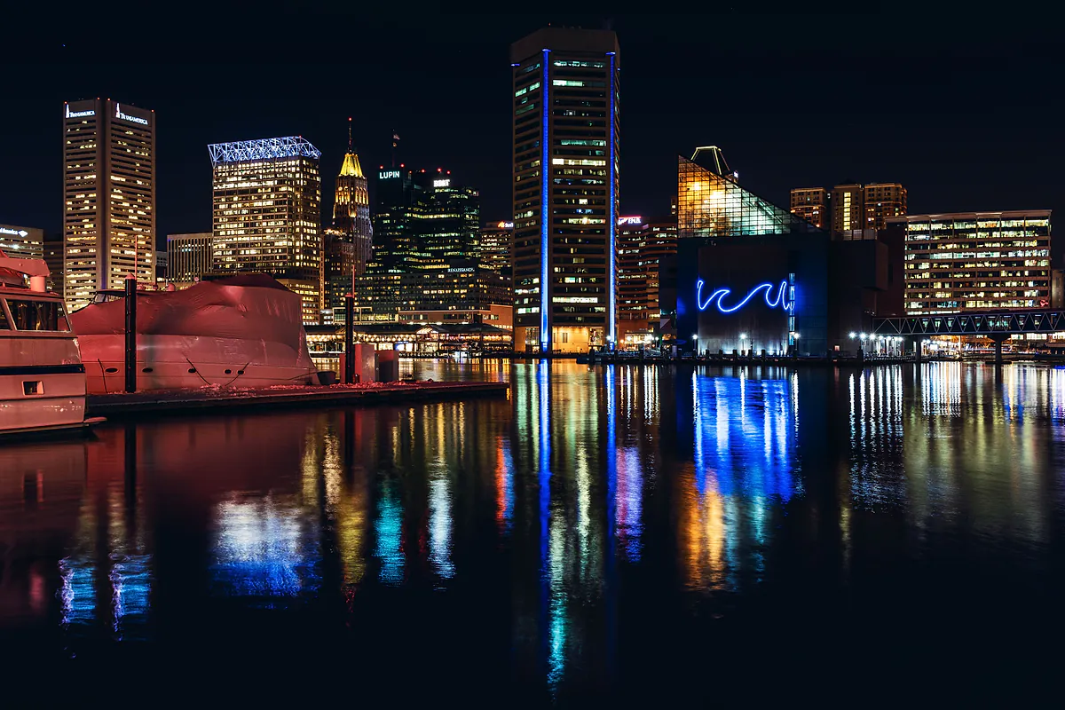 Baltimore skyline reflected in the Inner Harbor at night
