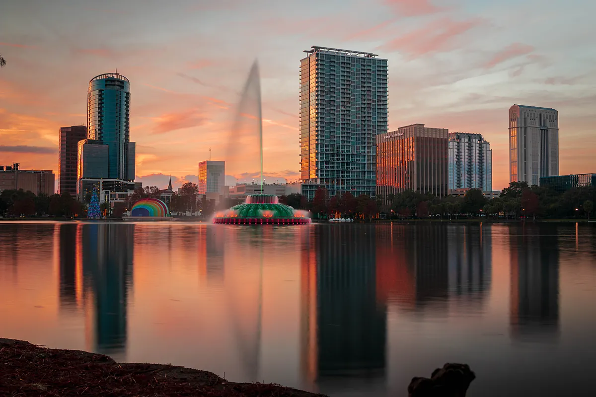 Downtown Orlando skyline reflected across Lake Eola