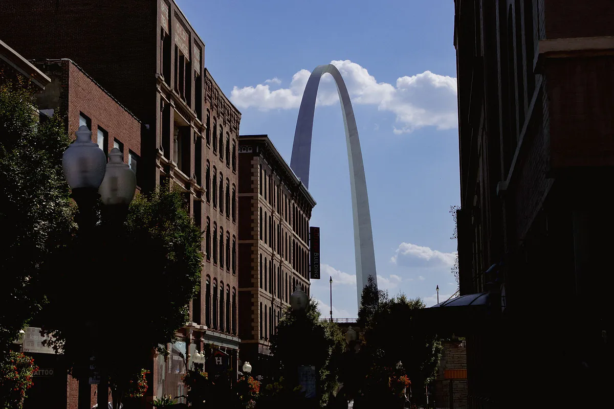 Gateway Arch framed by downtown St. Louis buildings